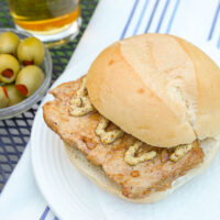 Bifana Portuguese marinated pork sandwich with mustard