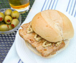 Bifana Portuguese marinated pork sandwich with mustard