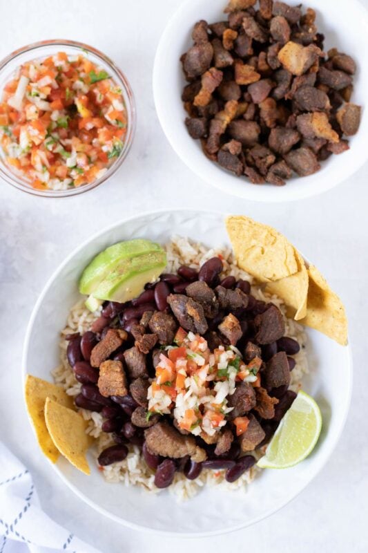 Costa Rican Chifrijo served with chimichurri and chips