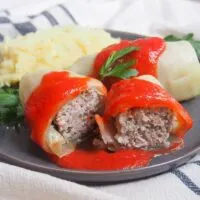 Golabki Polish cabbage rolls with pork and tomato sauce cut open