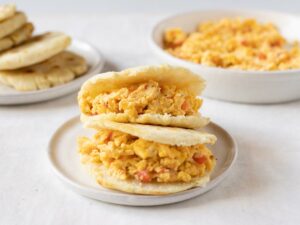 Perico - Venezuelan scrambled eggs with vegetables served in arepas