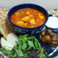Abgoosht (Iranian Meatball and Potato Stew) with herb salad