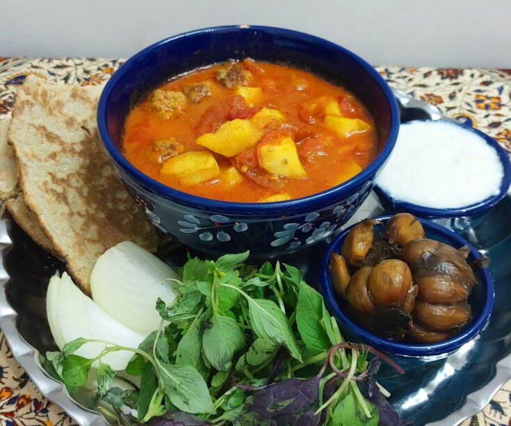 Abgoosht (Iranian Meatball and Potato Stew) with herb salad