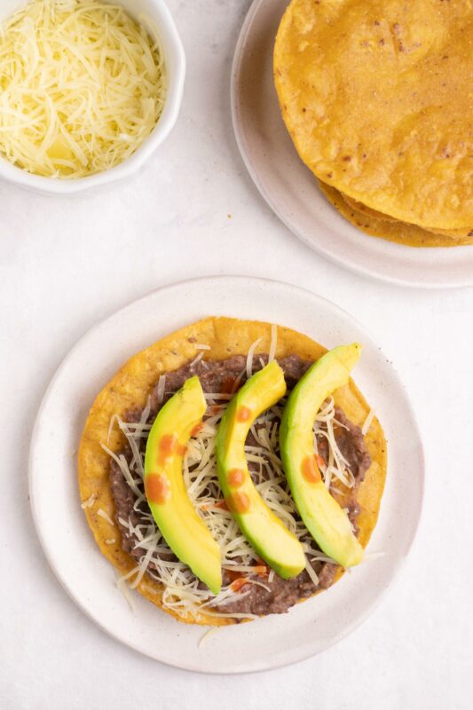 Catrachas Honduran bean tostada with avocado