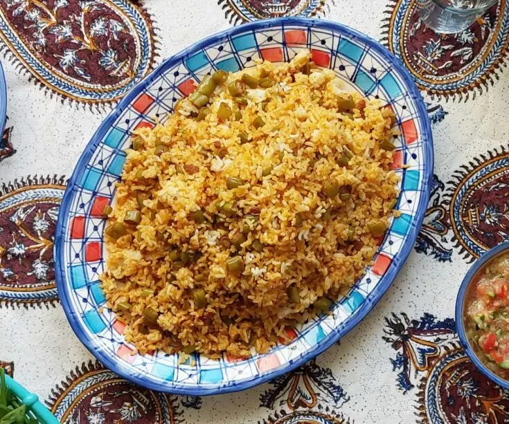 Estanboli Iranian tomato rice served for a meal