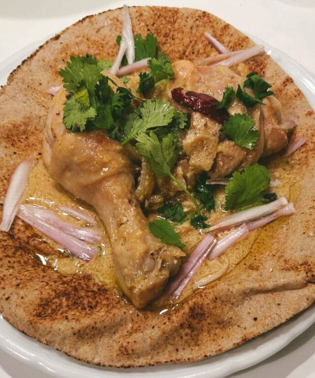 Padampuri Murgh (Padampuri chicken curry) on Indian flatbread