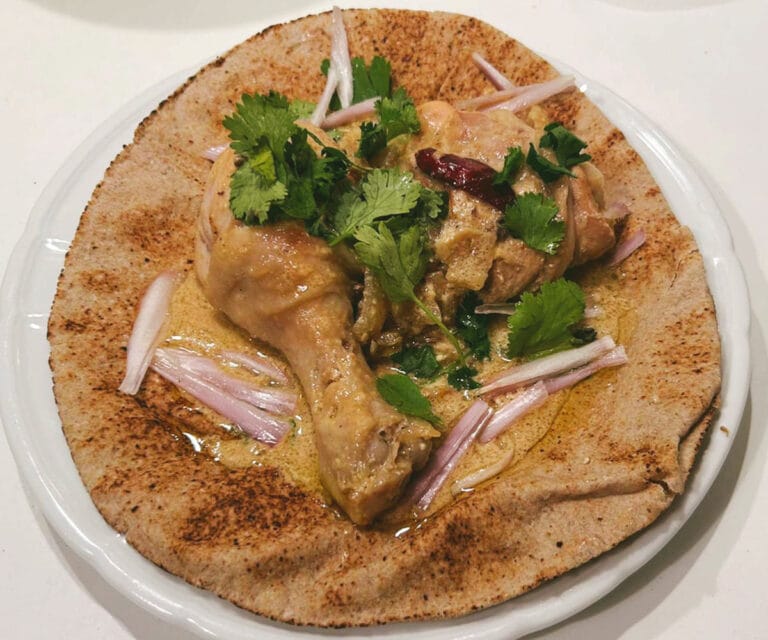 Padampuri Murgh (Padampuri chicken curry) on Indian flatbread