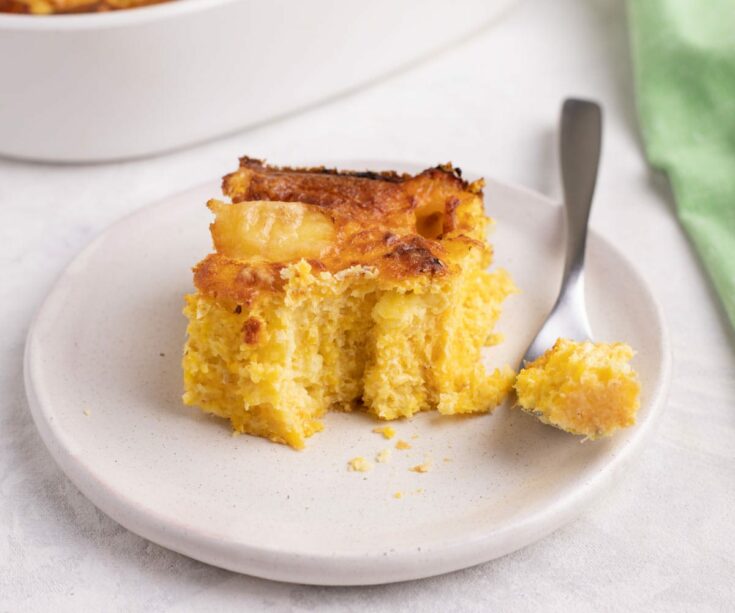 Chipa guasu Paraguan cornbread pudding with cheese eaten with a fork