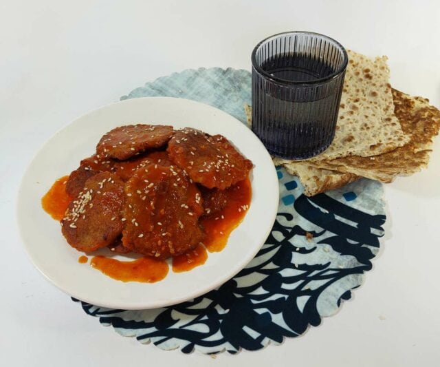 Iranian shami kebab with tomato sauce served with lavash bread