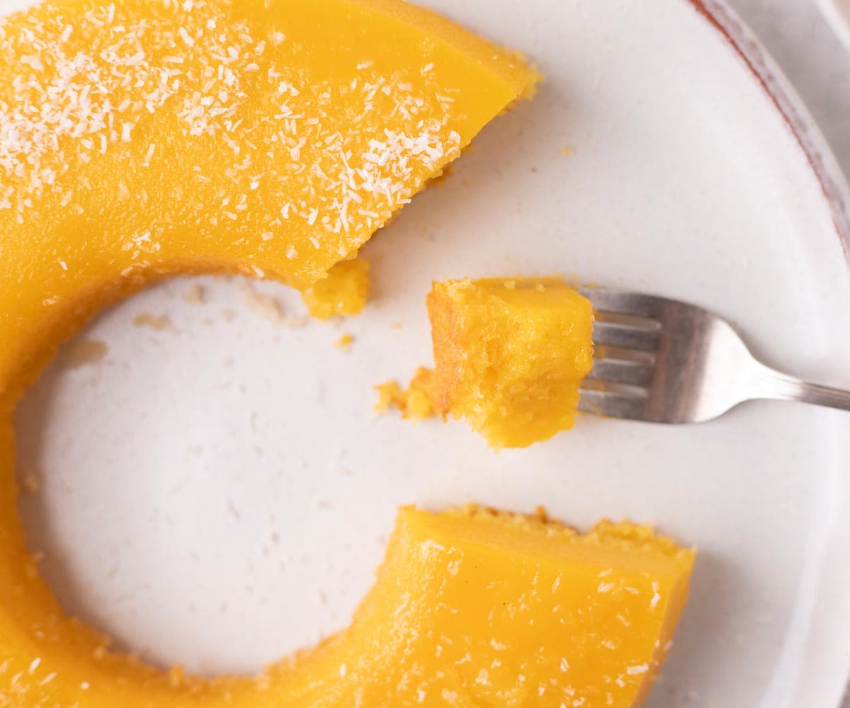 desserts from around the world quindim brazilian coconut custard - egg custard bite on a fork