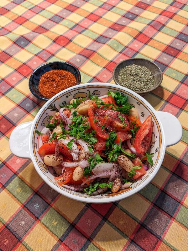 Piyaz Turkish White Bean Salad served with oregano and Aleppo pepper