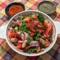 Piyaz Turkish White Bean Salad served with oregano and Aleppo pepper