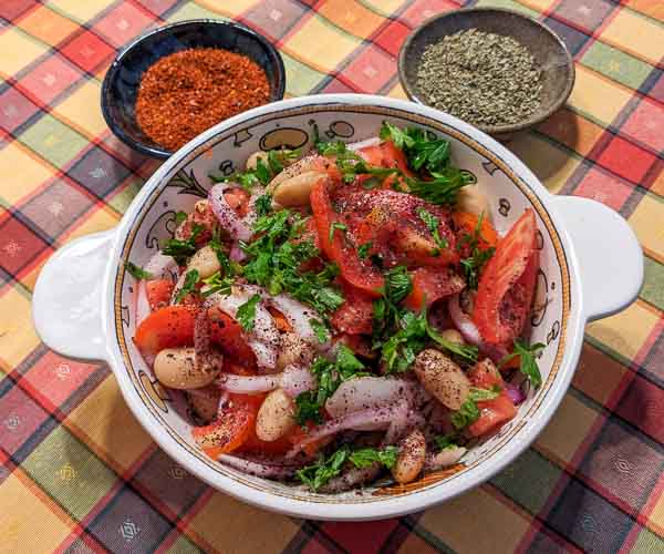 Piyaz Turkish White Bean Salad served with oregano and Aleppo pepper
