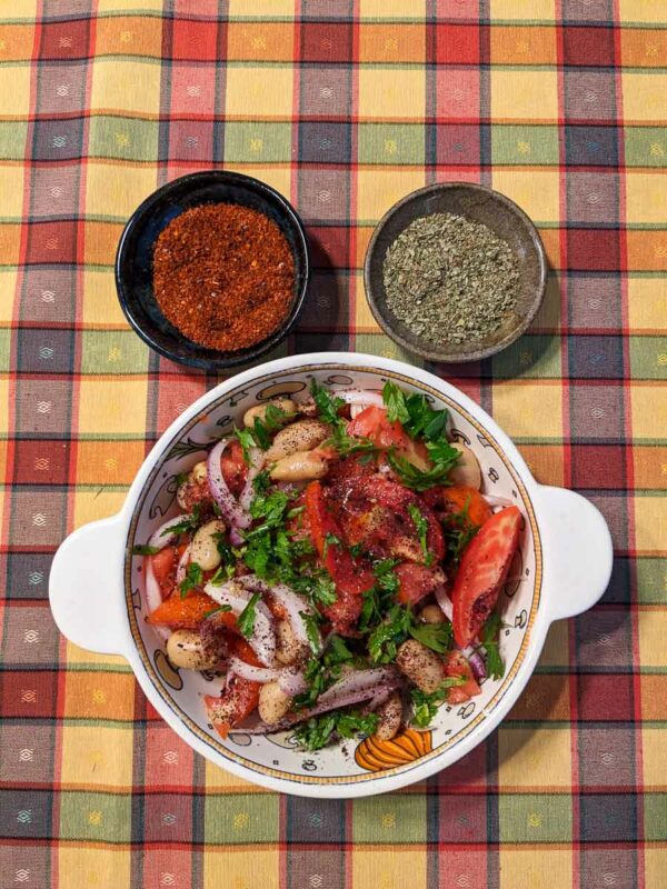 Piyaz Turkish White Bean Salad served with oregano and Aleppo pepper