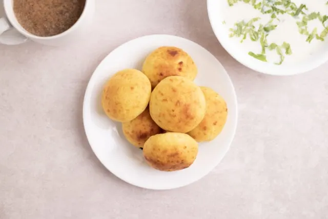 Almojabana -- Colombian cheese bread served with Colombian hot chocolate and breakfast soup