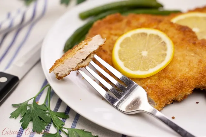 Schweineschnitzel (German Pork Schnitzel) cut shot